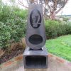 Kereru corten outdoor fireplace brazier in chiminea shape with wood storage made with New Zealand steel - front