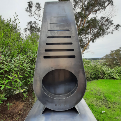 Ladder corten outdoor fireplace brazier in chiminea shape with wood storage made with New Zealand steel - front