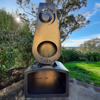 Koru corten outdoor fireplace brazier in chiminea shape with wood storage made with New Zealand steel - overall