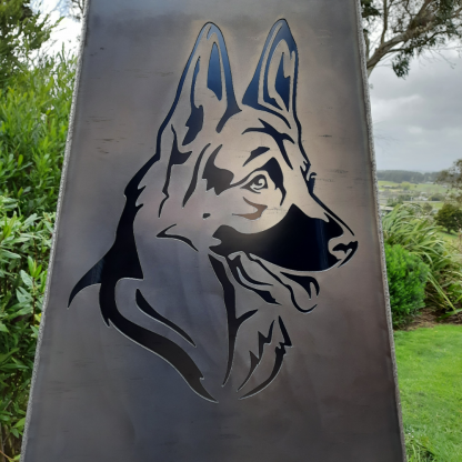 Dog corten outdoor fireplace brazier in chiminea shape with wood storage made with New Zealand steel - close